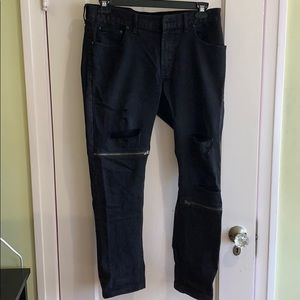 Black rip and zipper jeans